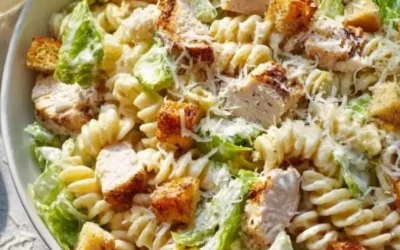 Delicious Chicken Caesar Pasta Salad served in a bowl with fresh ingredients.