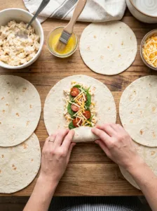 Hands rolling tortilla 202603230407