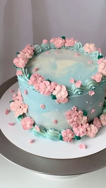 Beautifully decorated spring cake featuring buttercream designs by April’s Baker.