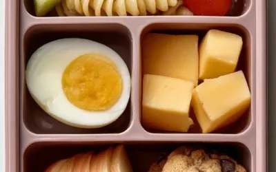 Variety of budget-friendly school lunches packed in colorful lunchboxes.