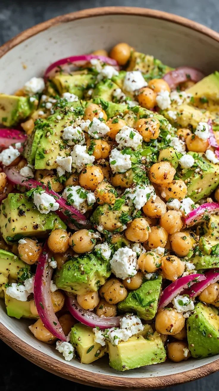 Chickpea salad with feta cheese and avocado in a colorful bowl