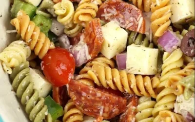 Bowl of classic pasta salad with vegetables and dressing