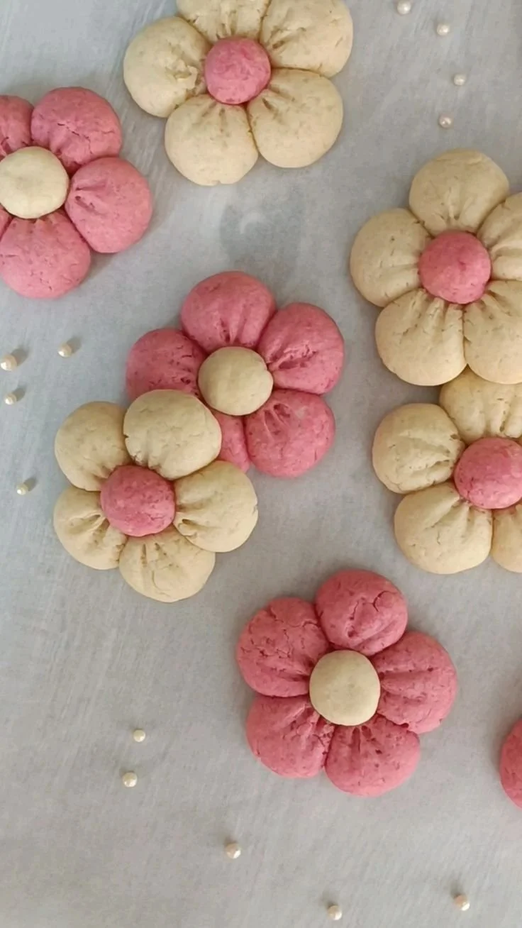 Beautifully decorated flower sugar cookies in vibrant colors.