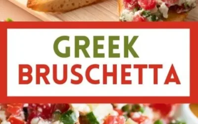 A plate of Greek Bruschetta topped with tomatoes, feta, and olives.