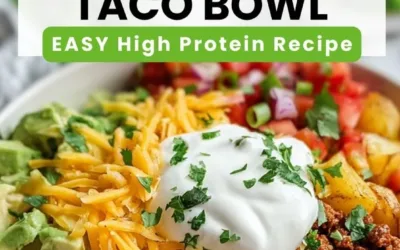 Delicious Loaded Potato Taco Bowl topped with cheese, sour cream, and fresh veggies.