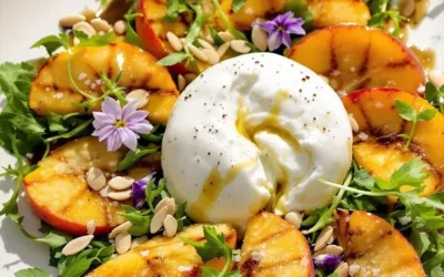Fresh Peach Burrata Salad with peaches, burrata cheese, and greens on a plate