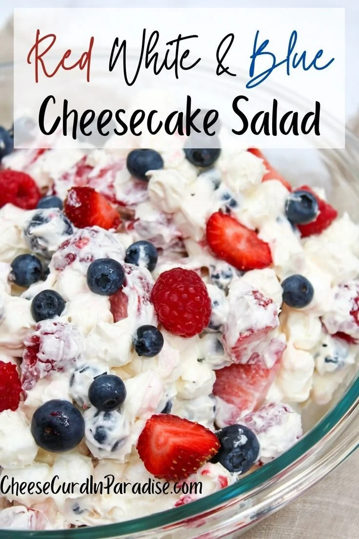 Red White and Blue Cheesecake Salad with strawberries, blueberries, and creamy cheesecake mix.