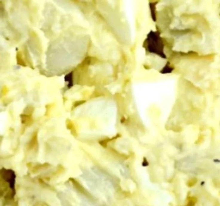 Bowl of creamy Southern potato salad with herbs and seasonings