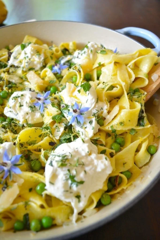 Plate of Spring Pea & Herb Pasta topped with Fresh Burrata cheese