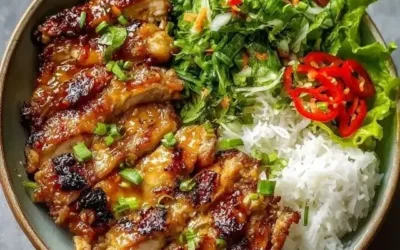 Plate of Vietnamese lemongrass chicken served with rice and vegetables