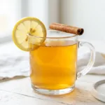 Brazilian Mounjaro recipe for weight loss in a clear glass mug with lemon garnish